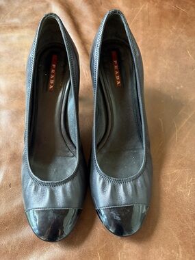 Prada Black Leather Round-Toe Heels with Patent Cap-Toe